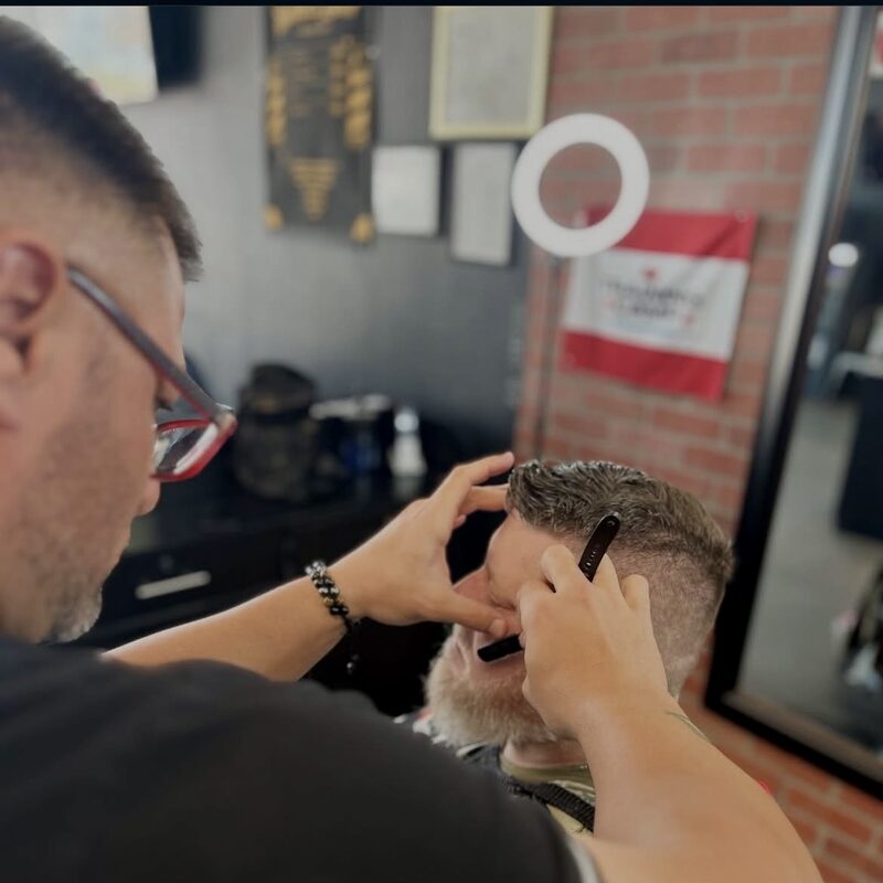 Dream Street barber crafting a precision cut